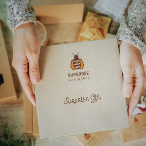a surprise gift in brown box with hands